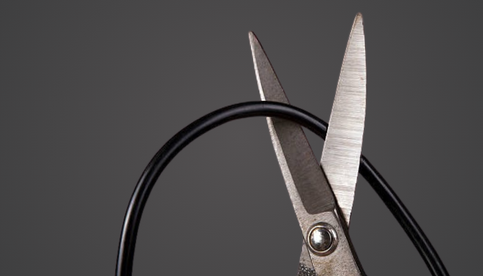 scissor cutting a cord